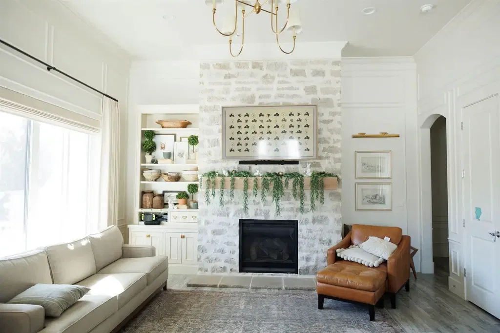 A cozy living room featuring a fireplace and a comfortable couch creating a warm and inviting atmosphere